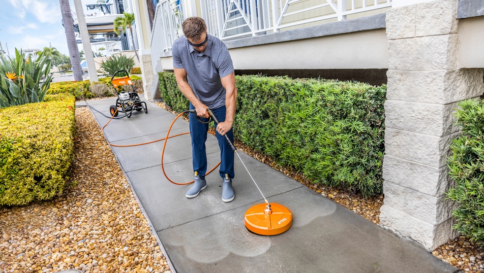 man pressure washing with RB 400