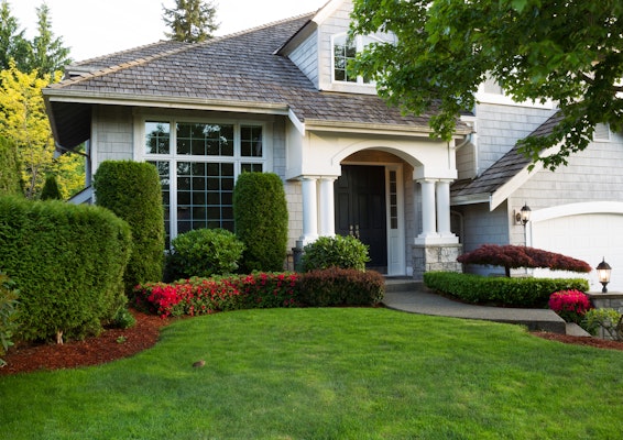 Beautiful home exterior during late spring season with clean landscape