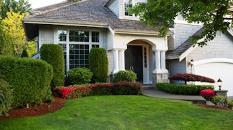 Beautiful home exterior during late spring season with clean landscape