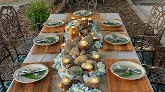 Finished tablescape with placemats and log candle holders 