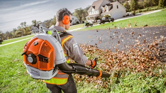 Professional landscaper working with STIHL blower