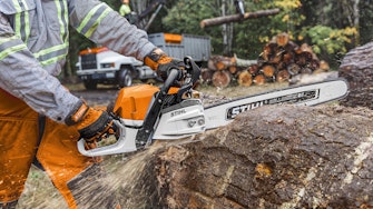 MS 400 C-M Chainsaw cutting through a log