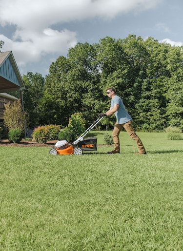 RMA 510 Mower Man using RMA 510 mower to mow yard