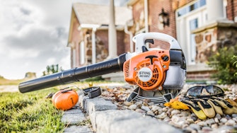 STIHL BG 56 C  blower sitting in rocks with personalized protection equipment.