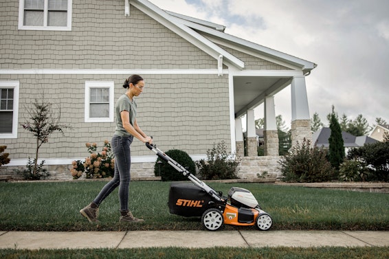 Woman mowing with STIHL RMA 460