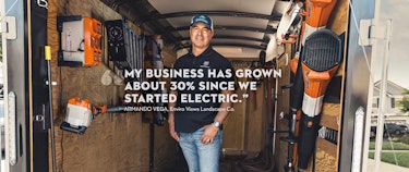 Landscaper in work truck with quote.