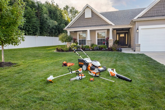 AK Battery System STIHL products in front yards