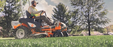 Professional Landscaper Mowing Grass with RZ 560 K