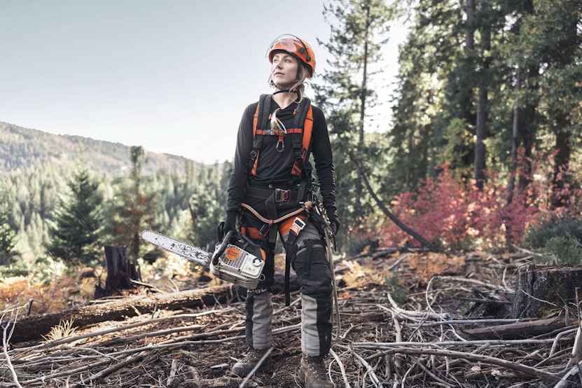 Katelyn Johnson holding STIHL chainsaw