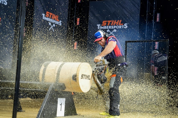 Nate Hodges cutting a log with STIHL Chainsaw at Timbersports event
